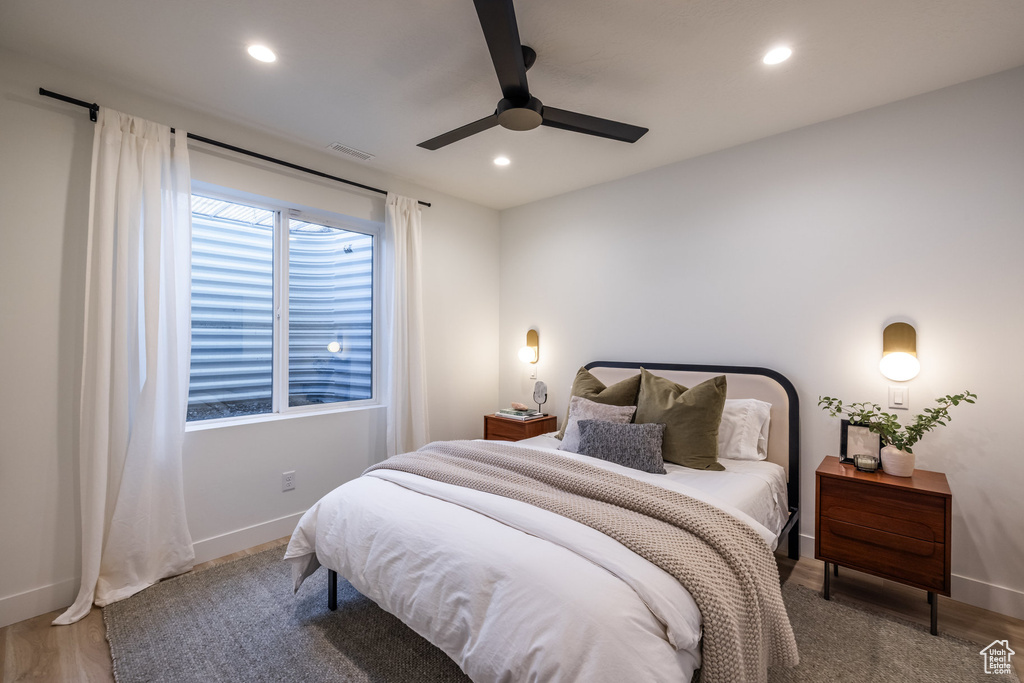 Bedroom featuring recessed lighting, ceiling fan, and wood finished floors