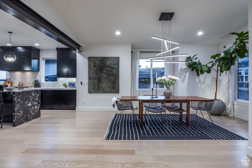 Dining room featuring light wood-style floors and recessed lighting