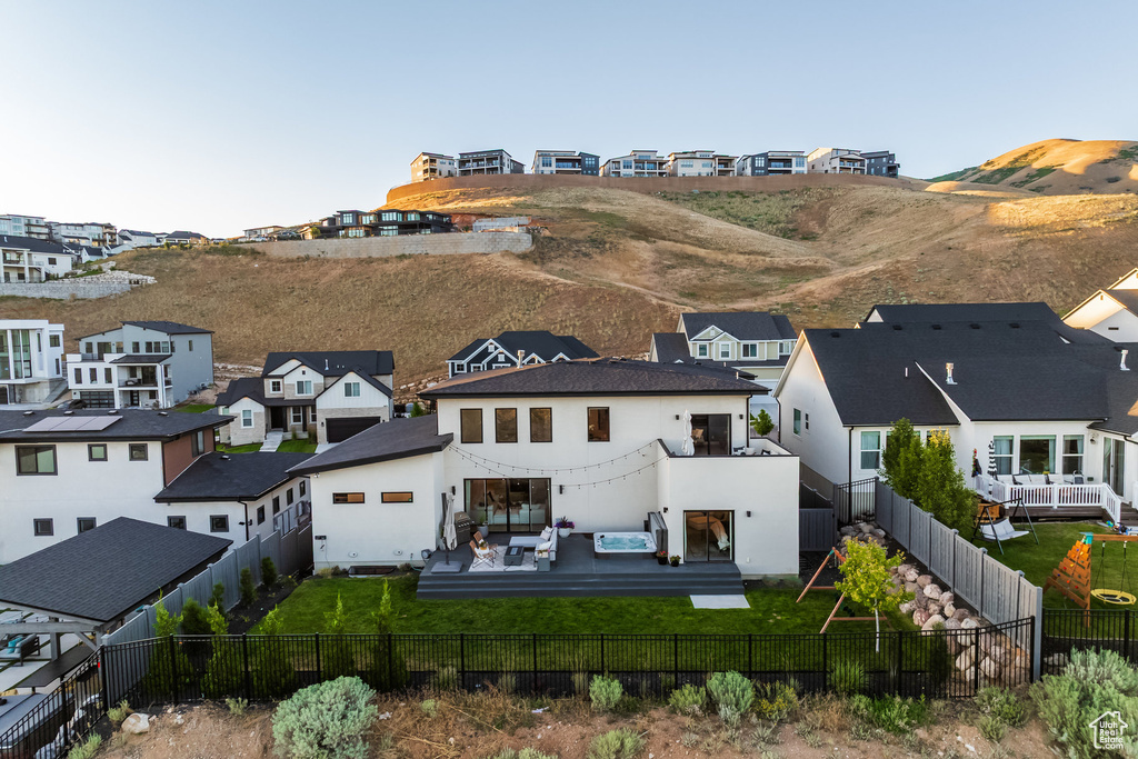 Aerial perspective of suburban area featuring a mountainous background