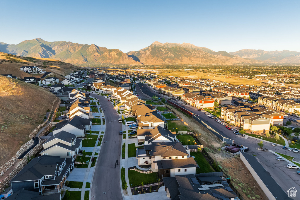 Aerial perspective of suburban area with a mountain backdrop