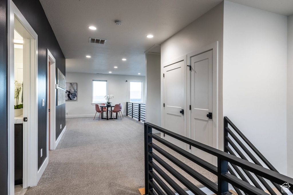 Hall with recessed lighting and carpet flooring