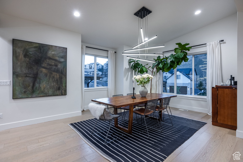 Dining space featuring light wood finished floors and recessed lighting