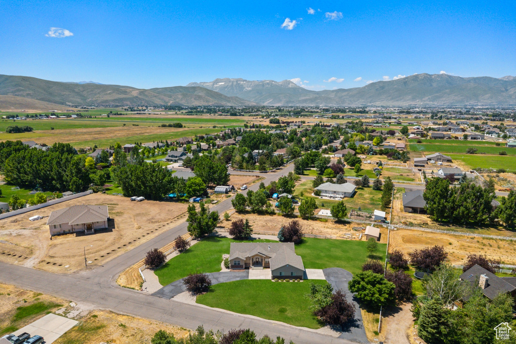 Aerial overview of property's location featuring a mountain backdrop