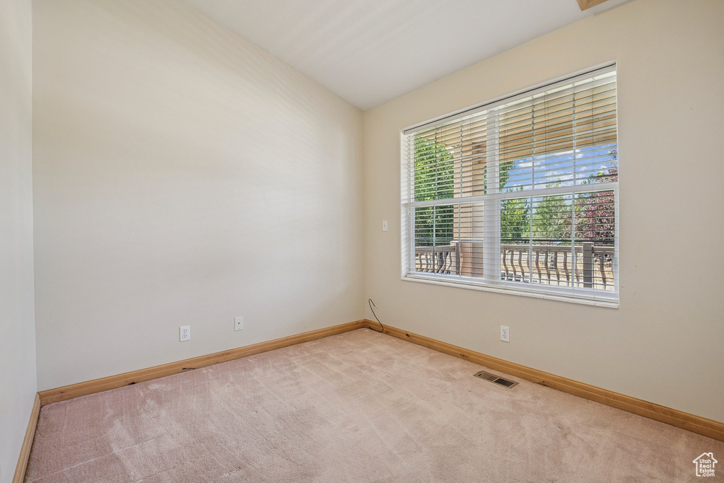 Empty room featuring carpet floors