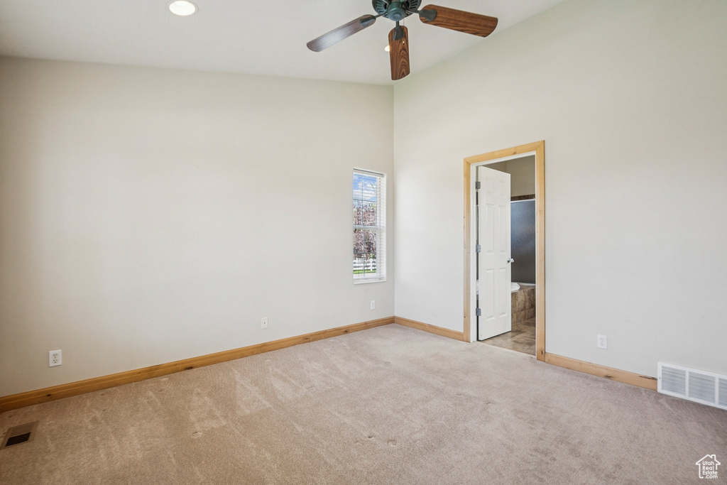 Spare room with carpet floors and ceiling fan