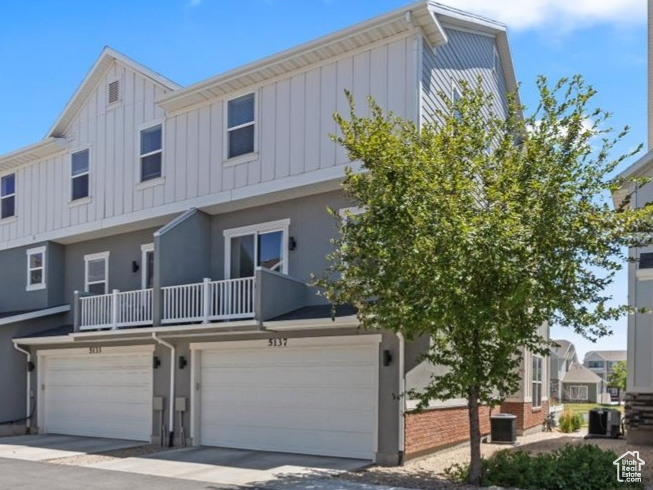 Multi unit property with board and batten siding, a residential view, and stucco siding