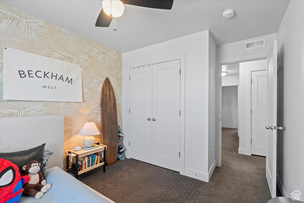 Bedroom featuring carpet flooring, a closet, and ceiling fan
