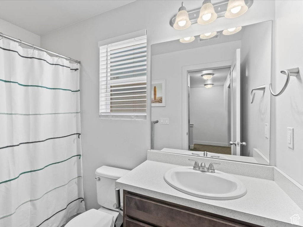 Full bath featuring vanity and a shower with shower curtain