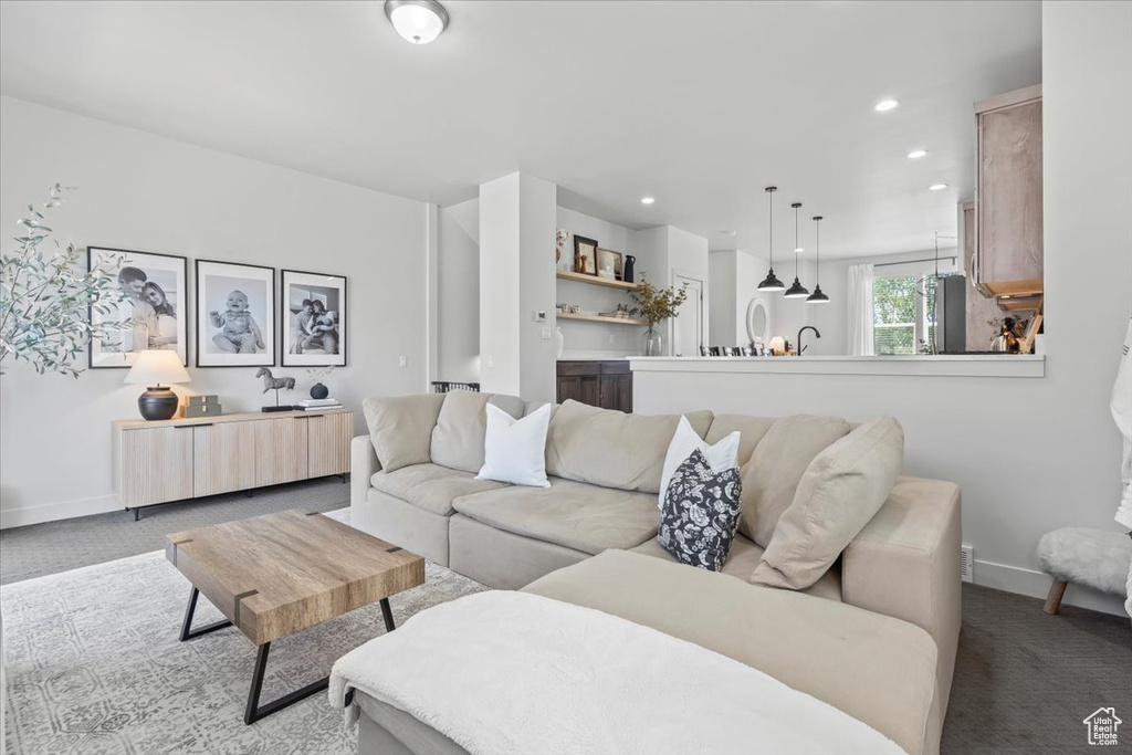 Living room featuring carpet and recessed lighting