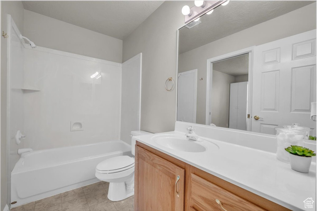 Bathroom featuring vanity and shower / bathtub combination