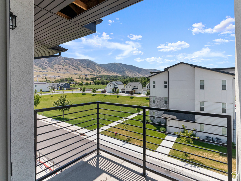Balcony featuring a mountain view and a residential view