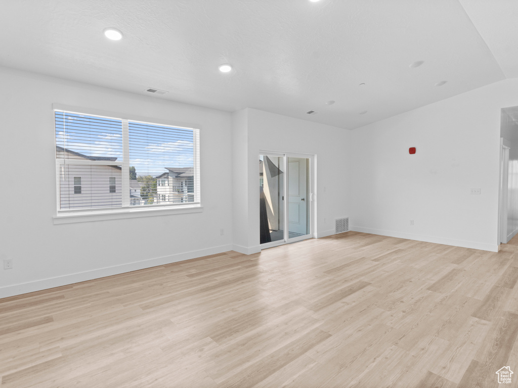 Spare room with light wood-style flooring and recessed lighting