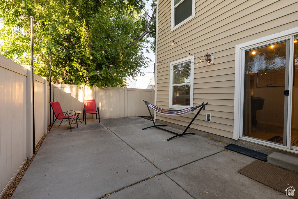 Fenced backyard with a patio area
