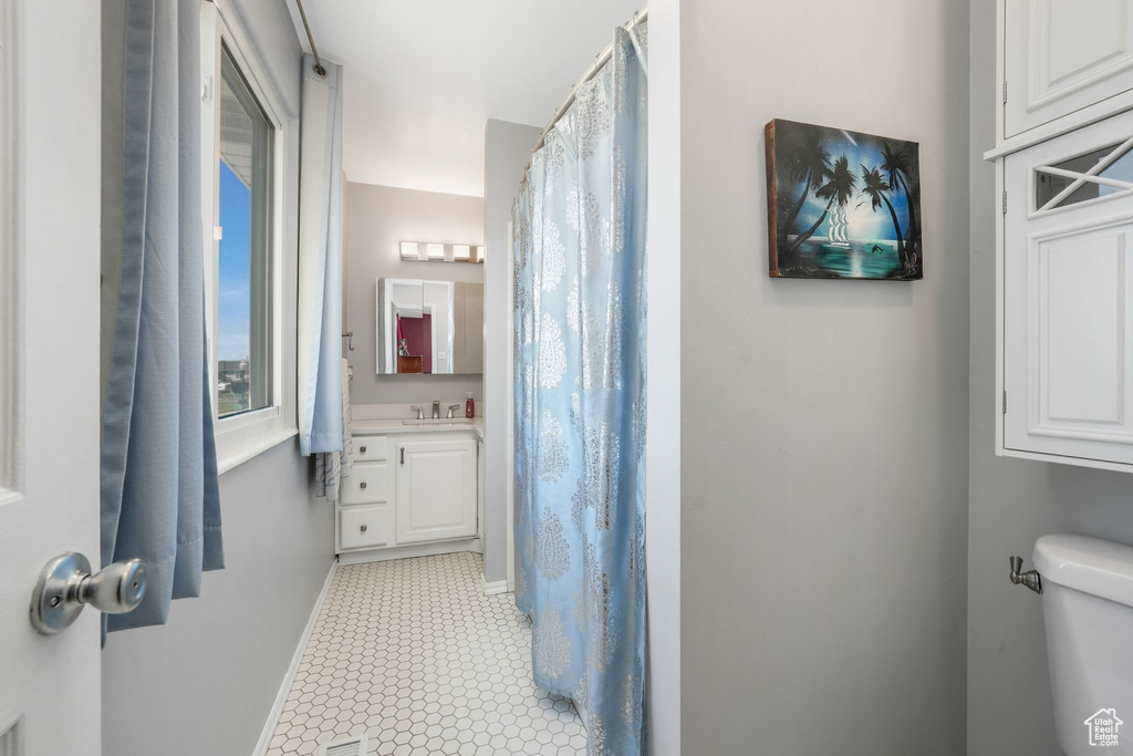 Bathroom featuring toilet and vanity