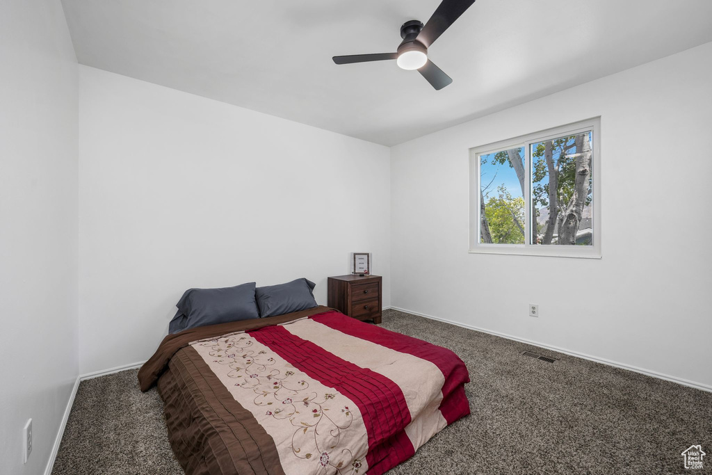 Bedroom with carpet flooring and ceiling fan