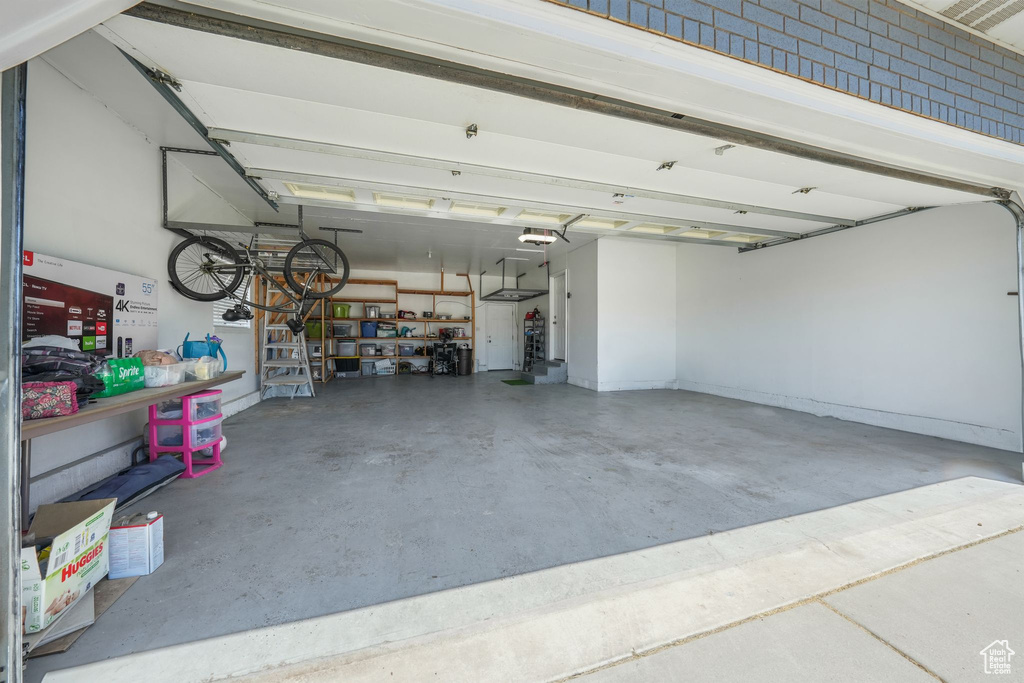 Garage featuring a garage door opener