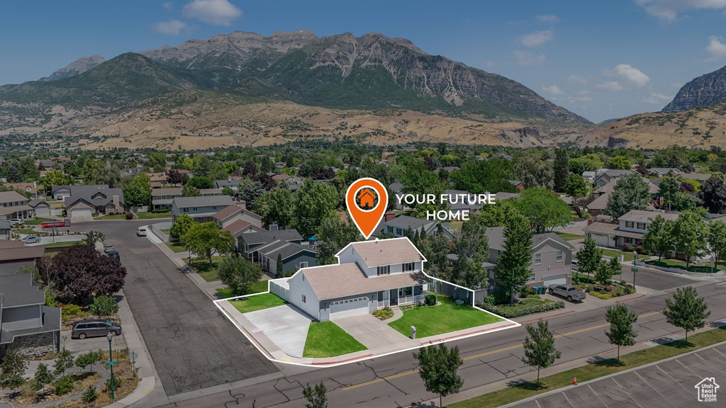 Aerial perspective of suburban area featuring a mountain backdrop