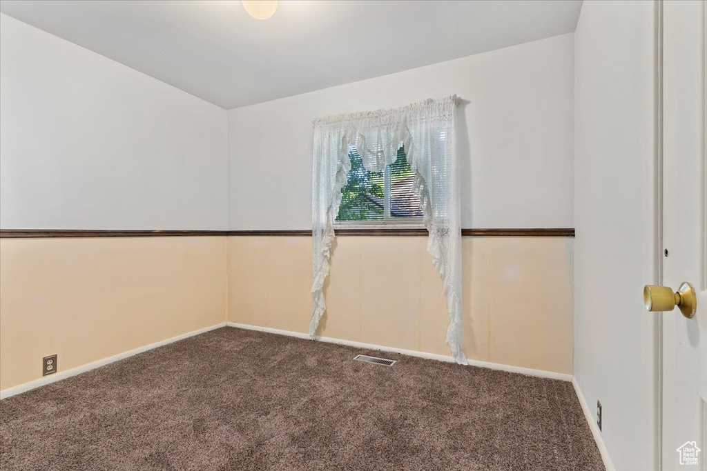Spare room with carpet floors