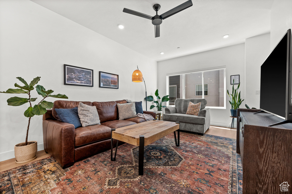 Living area with ceiling fan, dark wood finished floors, and recessed lighting