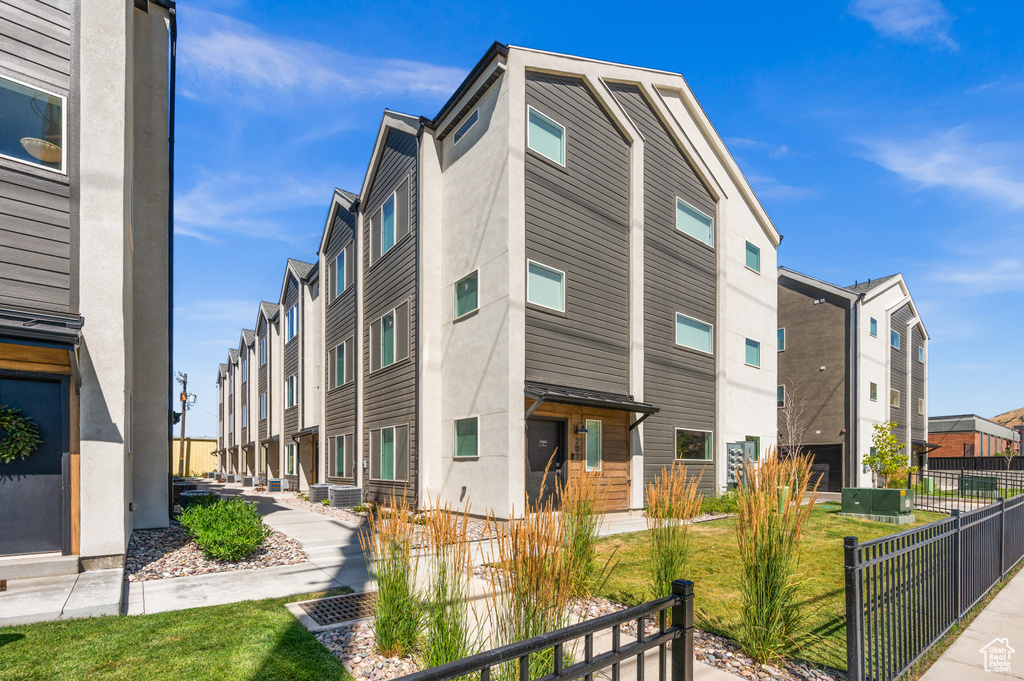 View of property with a residential view