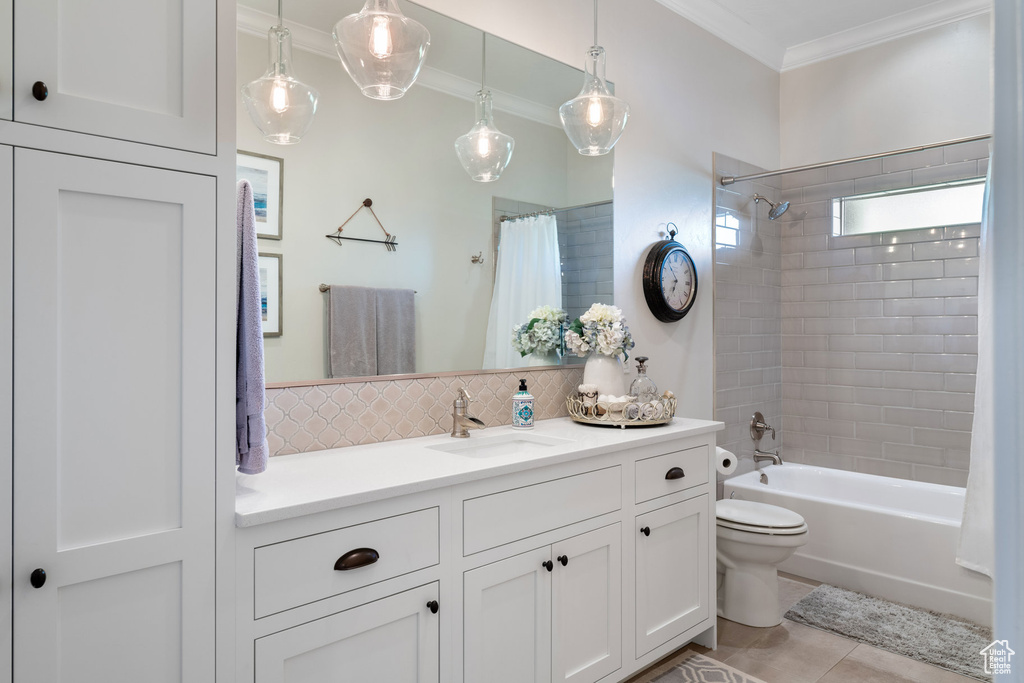 Full bathroom with ornamental molding, decorative backsplash, vanity, shower / tub combo with curtain, and tile patterned flooring