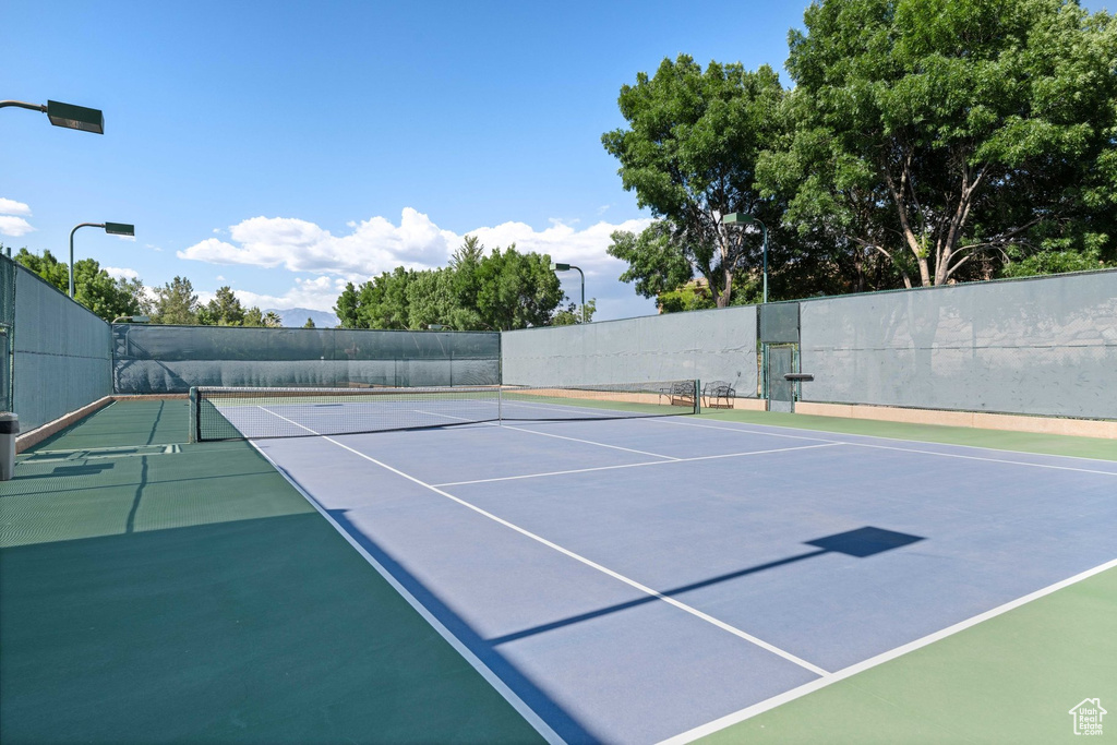 View of tennis court featuring community basketball court