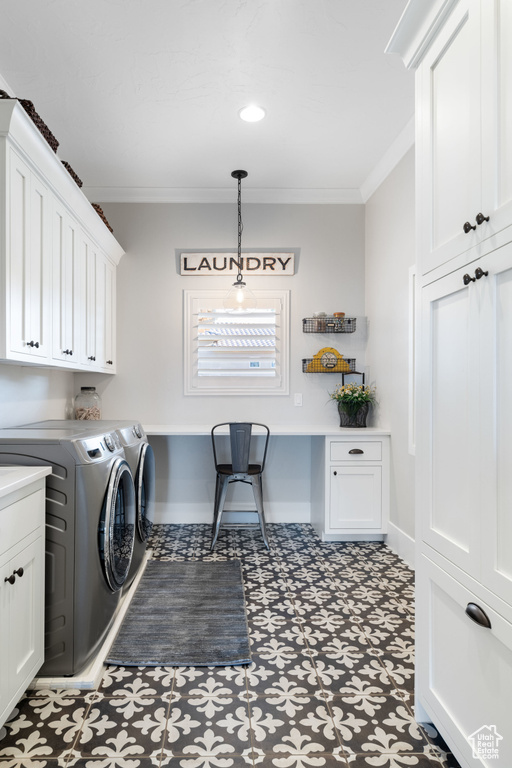 Laundry room featuring washer and clothes dryer, cabinet space, crown molding, and tile patterned floors