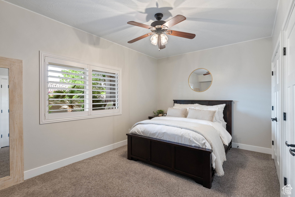 Bedroom featuring carpet and a ceiling fan