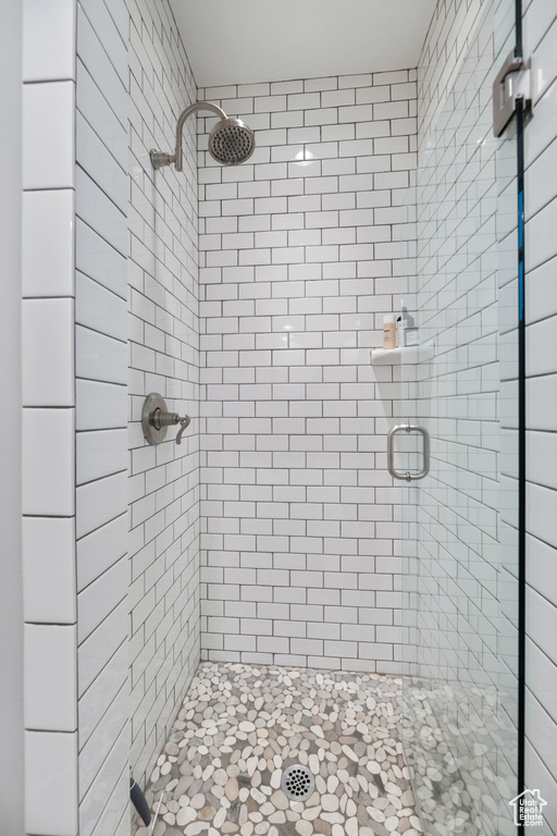 Full bathroom featuring a stall shower