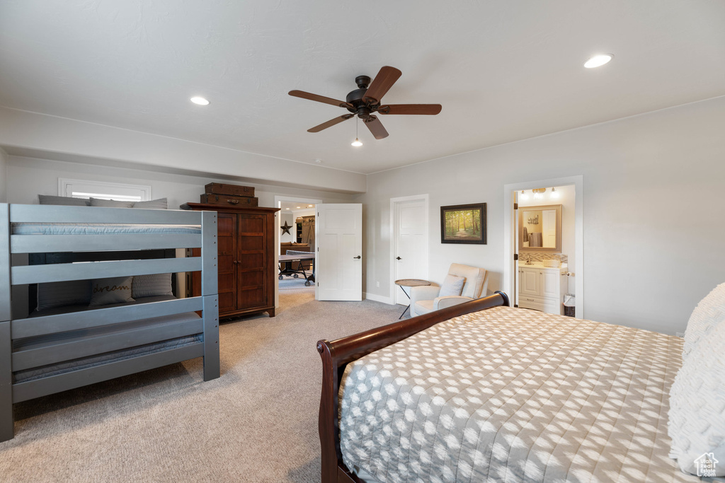 Carpeted bedroom with recessed lighting, ensuite bathroom, and a ceiling fan