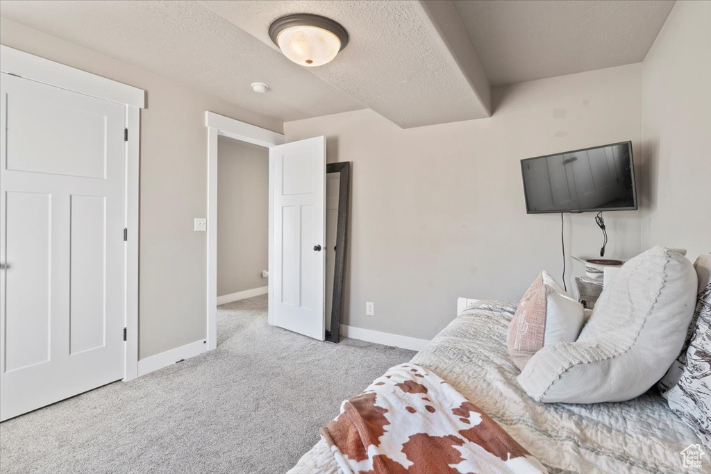 Bedroom with carpet and baseboards