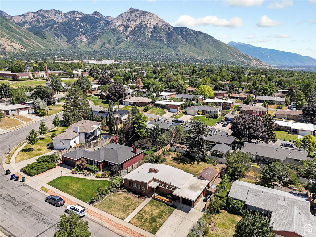 Aerial view of residential area featuring a mountainous background