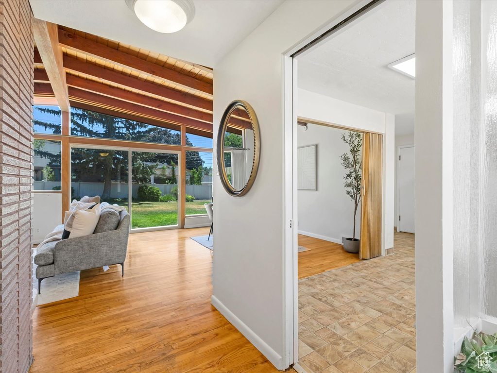 Hall featuring light wood-style floors and baseboards