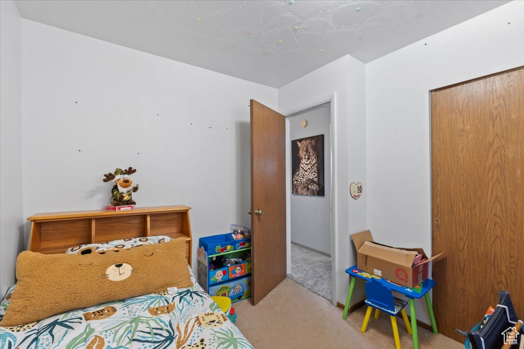Bedroom featuring carpet flooring
