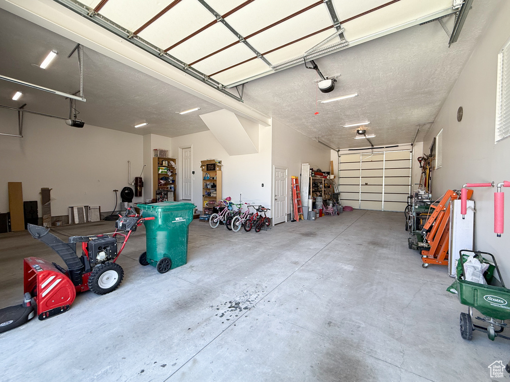 Garage featuring a garage door opener