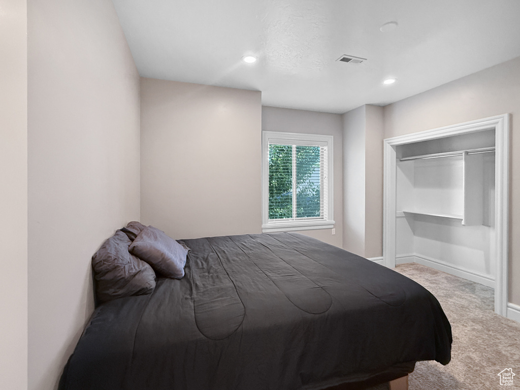 Bedroom featuring carpet and recessed lighting