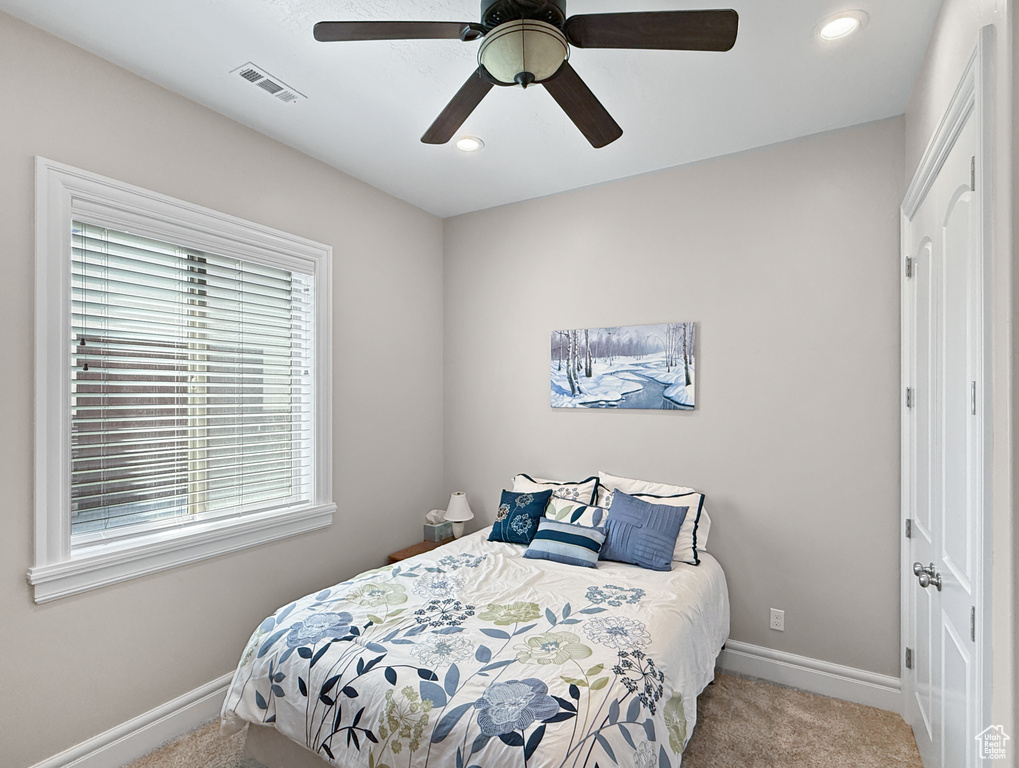 Bedroom featuring carpet flooring, recessed lighting, and ceiling fan