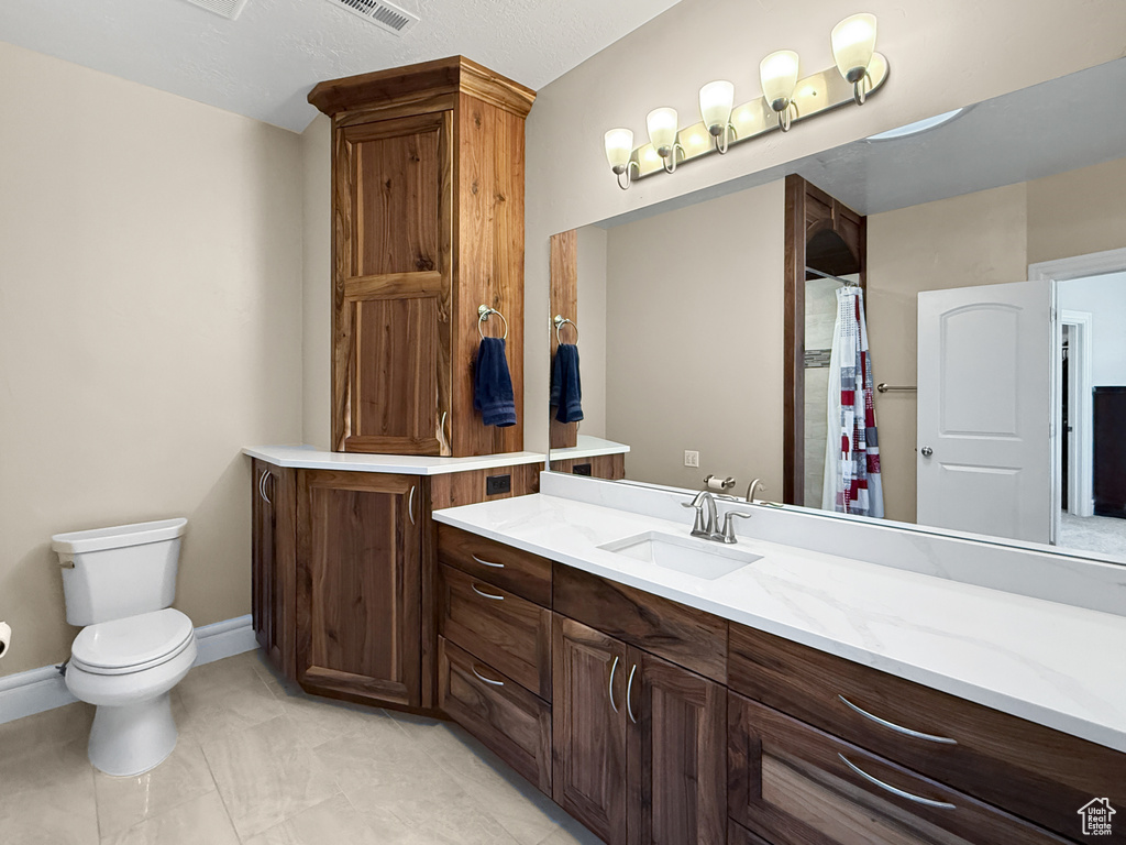 Full bathroom with vanity and a shower with curtain