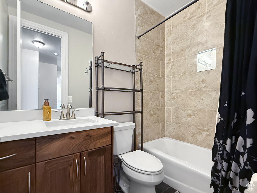Full bathroom with vanity and shower / tub combo