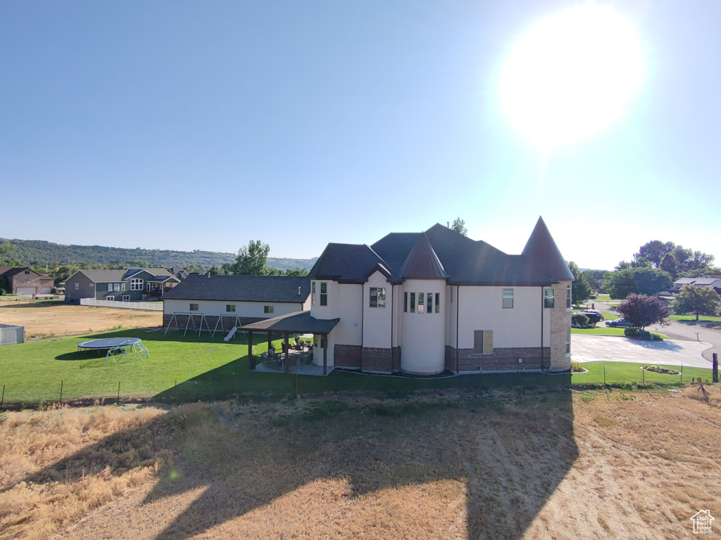 View of home\'s exterior with stucco siding and stone siding