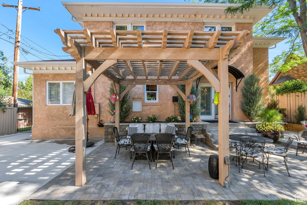 View of patio / terrace with outdoor dining space and a pergola