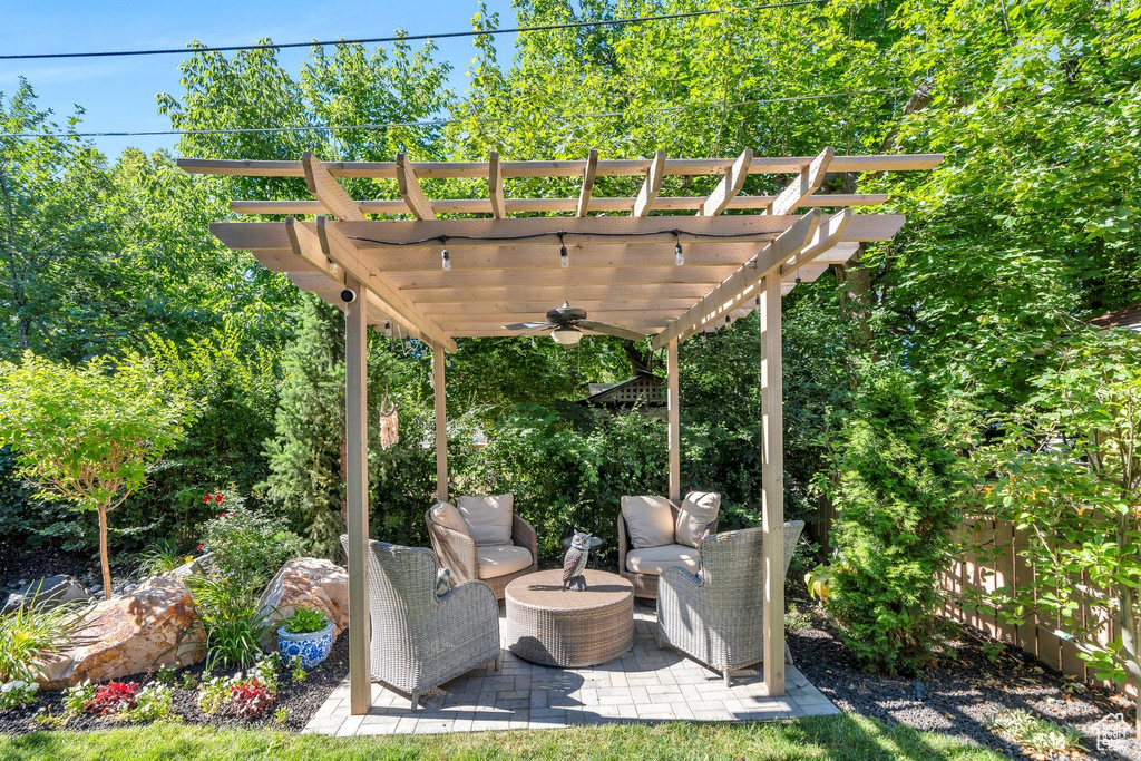 View of patio / terrace with a ceiling fan and a pergola