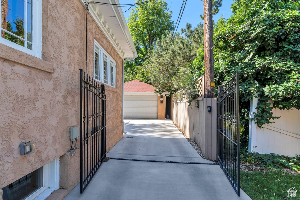 Gate featuring an outbuilding