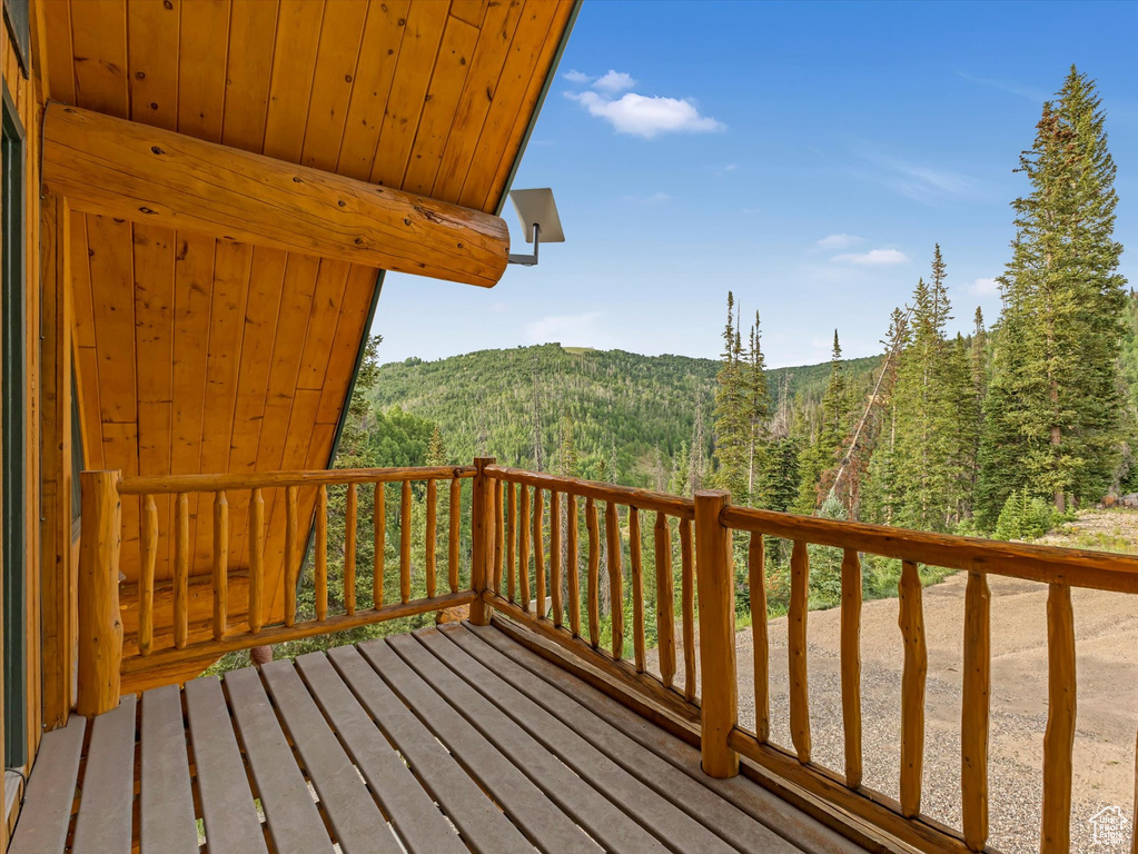 Wooden deck featuring a mountain view