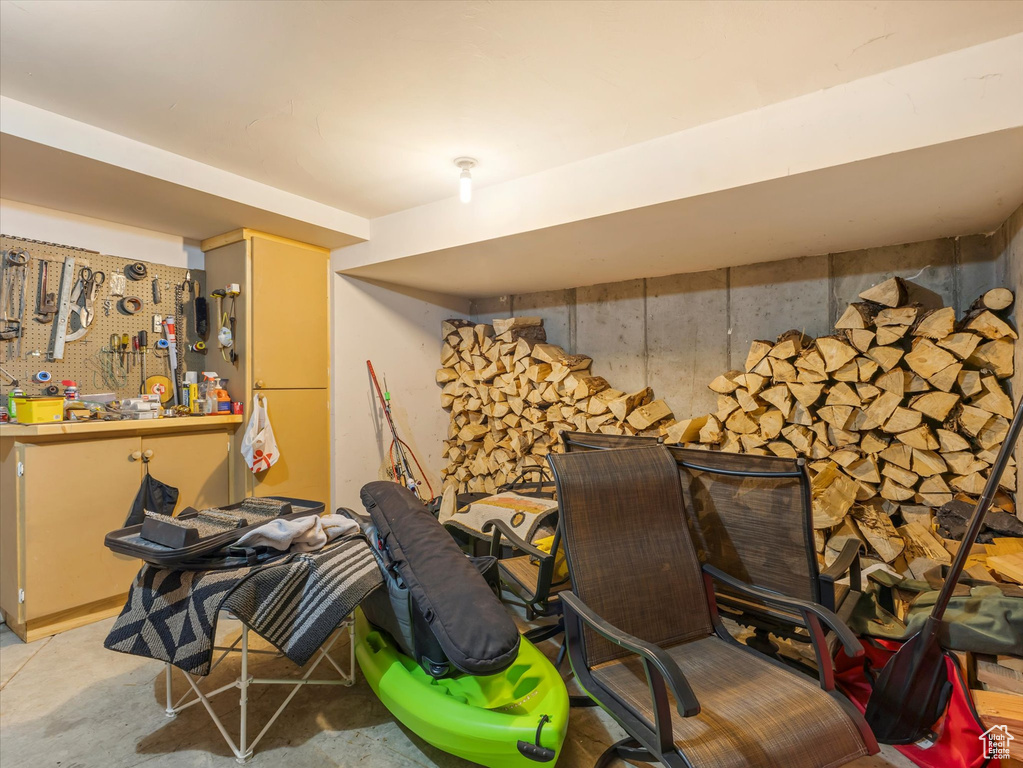 Miscellaneous room featuring concrete floors and a workshop area