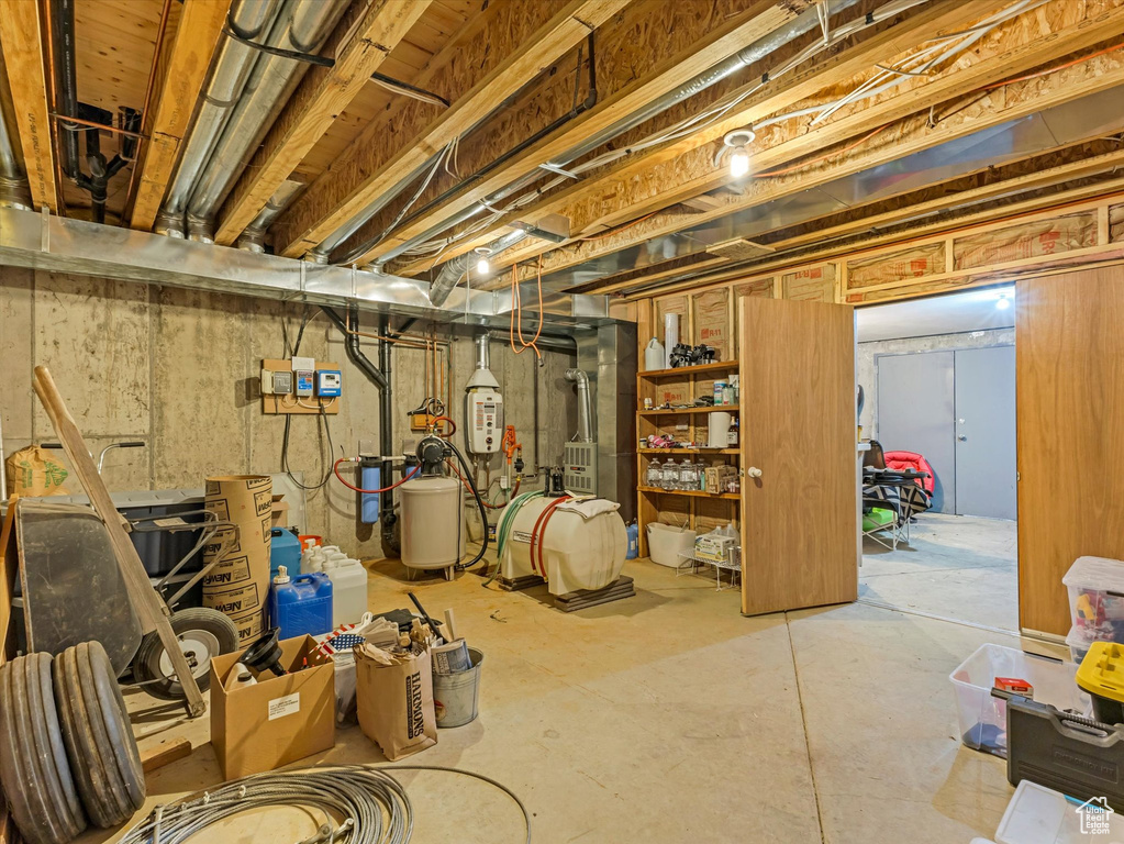 Unfinished below grade area featuring a water softener
