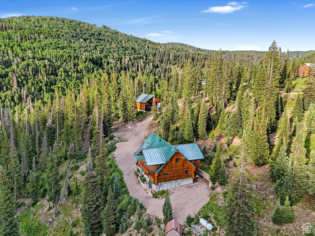 View from above of property with a forest