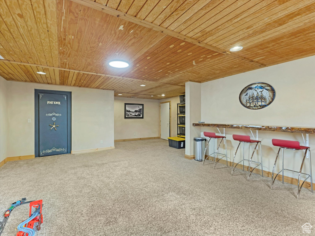 Playroom with wooden ceiling, carpet floors, and recessed lighting