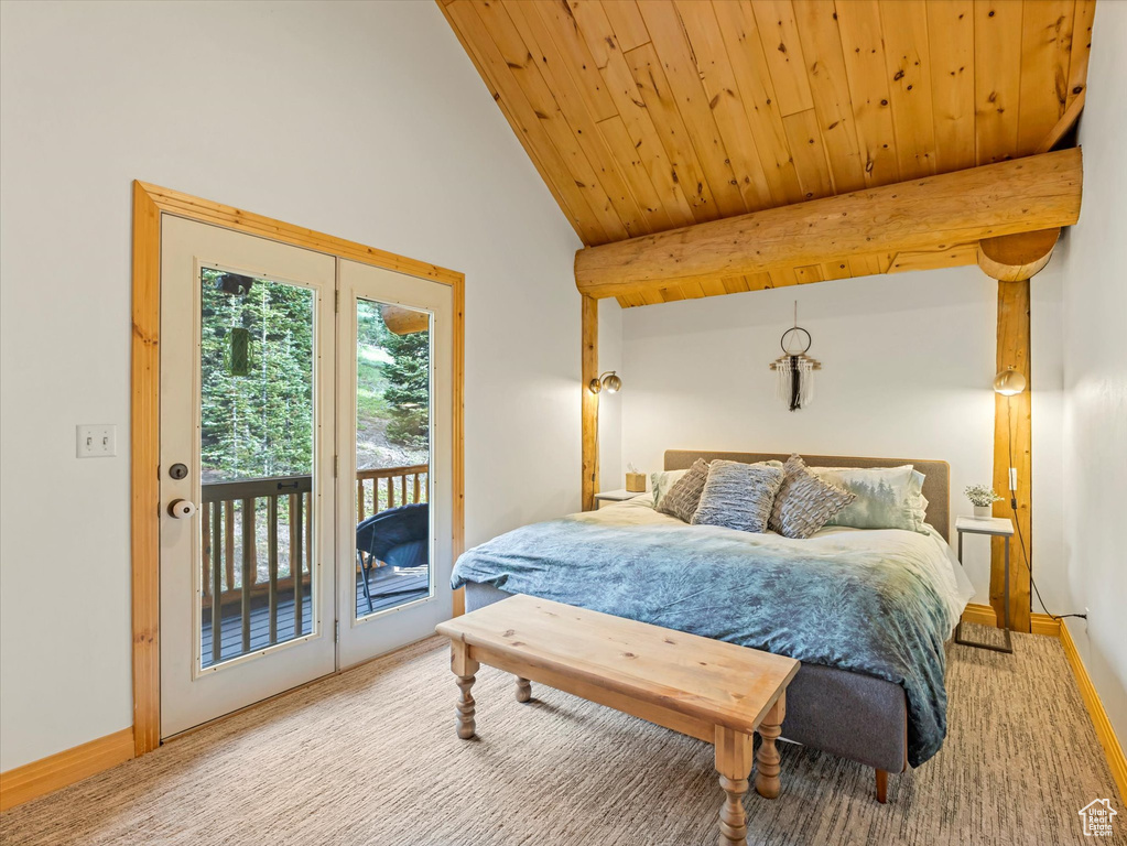 Bedroom featuring access to exterior, carpet, and wooden ceiling
