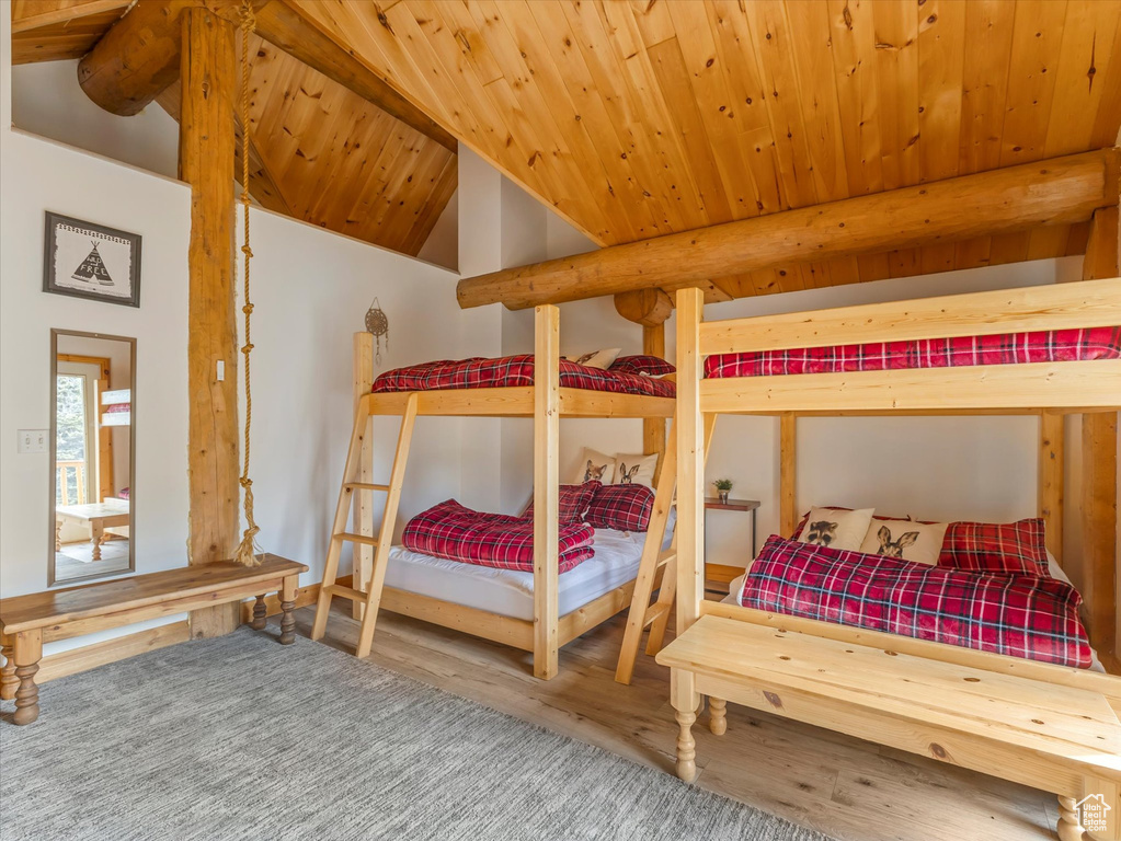 Bedroom with wood finished floors and wooden ceiling